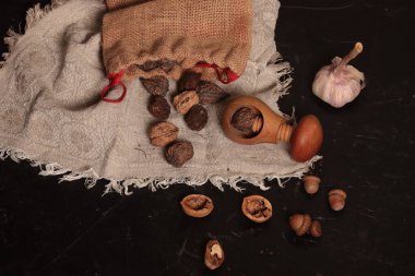 Nutcracker and nuts in shell on a linen napkin