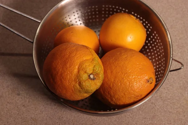 Ripe Oranges Metal Colander — стоковое фото