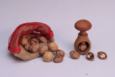 Walnuts sprinkled on white background