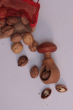 Walnuts sprinkled on white background