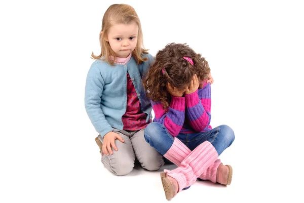 Tristes petites filles isolées sur blanc — Photo