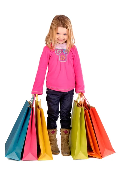 Niña con bolsas de compras — Foto de Stock