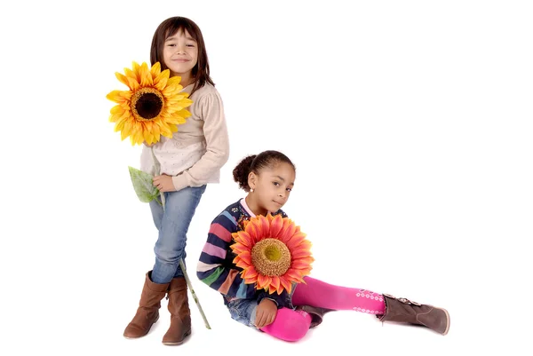 Girls holding flowers — Stock Photo, Image