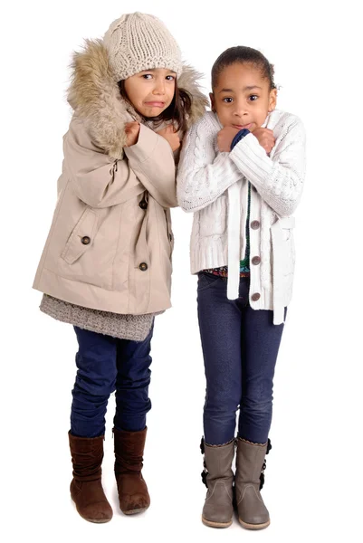 Маленькі дівчата взимку ізольовані на білому — стокове фото