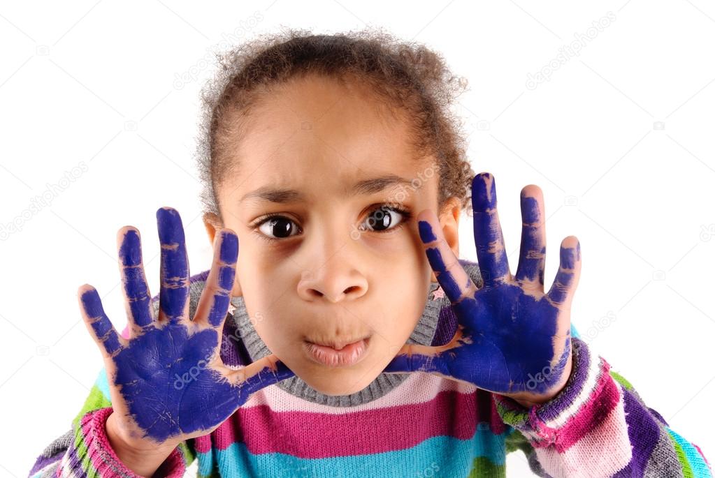 Five year old girl with hands painted