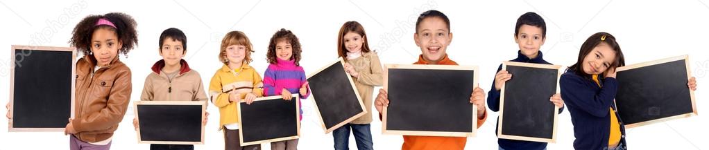 little kids holding a black board