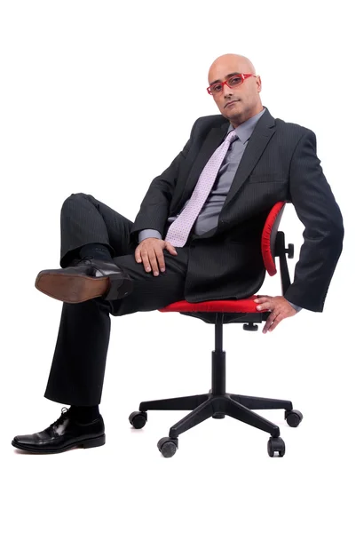 Obchodní muž na židli — Stock fotografie
