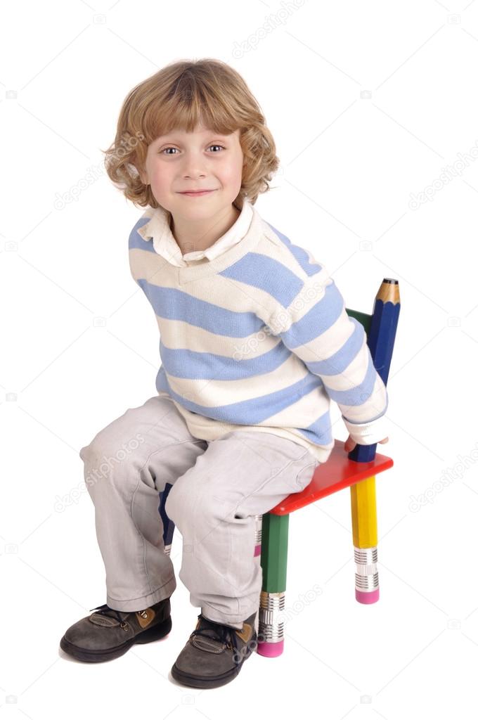 Niño sentado en una silla: fotografía de stock © verkoka #23651993 ...