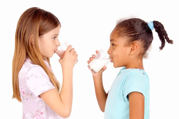 Littles girls with milk — Stock Photo, Image