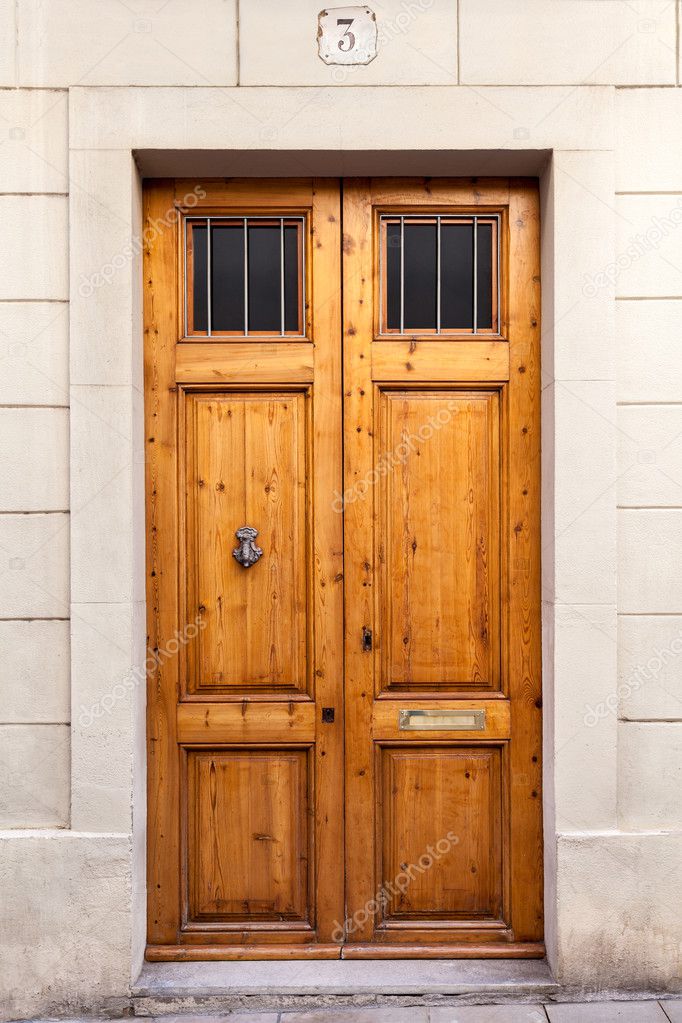 Double wooden door with knocker