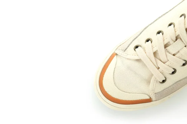 孤立在白色背景上的一个米色运动鞋 — 图库照片