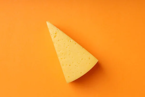 Piece Hard Cheese Orange Background — Stock Photo, Image