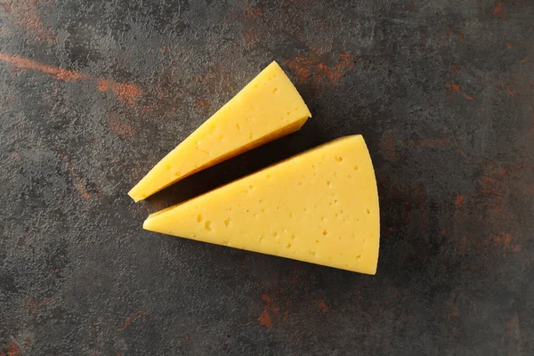 Two Pieces Hard Cheese Textured Background — Stock Photo, Image