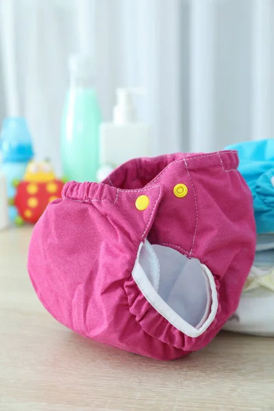 Concepto Ropa Bebé Con Pañales Reutilizables Mesa Texturizada Gris — Foto de Stock