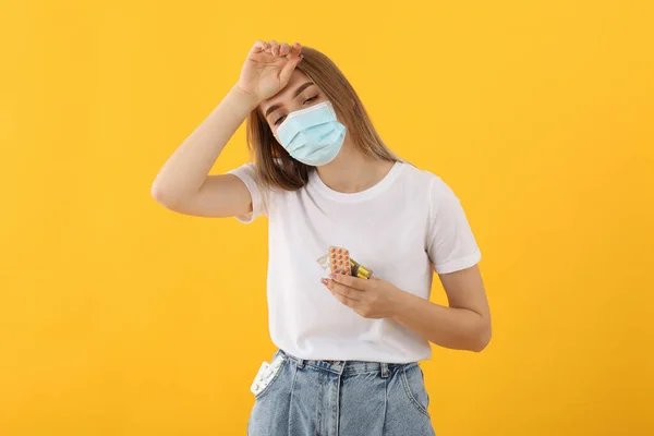 Sick Girl Mask Pills Yellow Background — Stock Photo, Image