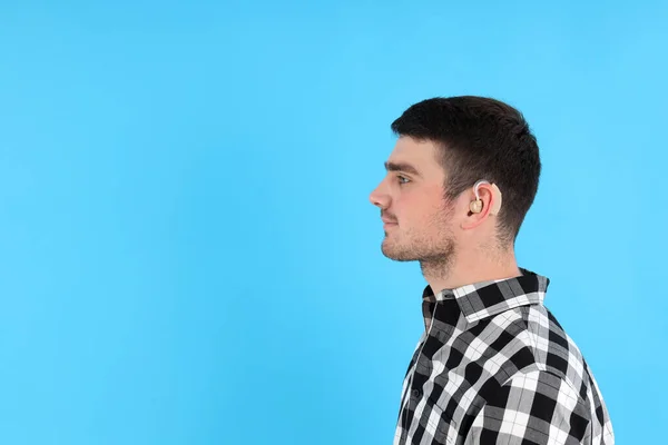 Young Man Hearing Aid Blue Background — Stock Photo, Image