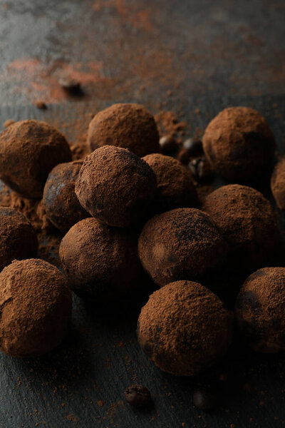 Concept of sweets with truffles on dark textured background