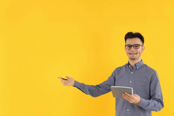Attractive Guy Notebook Pen Yellow Background — Stock Photo, Image