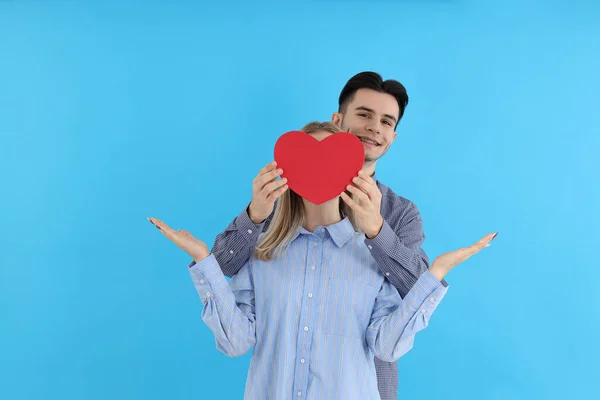 Cute Couple Holds Heart Blue Background — 图库照片