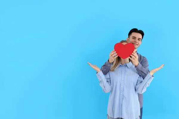Cute Couple Holds Heart Blue Background — 图库照片