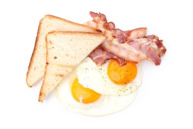 Fried eggs, bacon and toasts isolated on white background