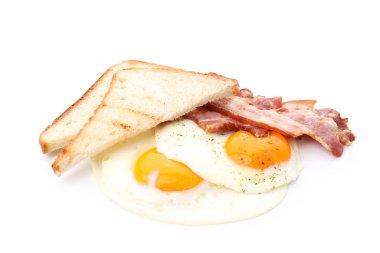Fried eggs, bacon and toasts isolated on white background