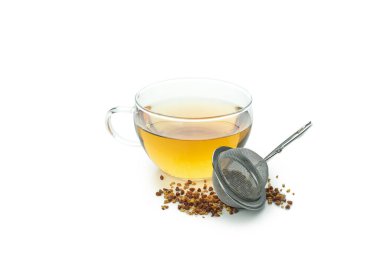 Concept of hot drink with buckwheat tea isolated on white background