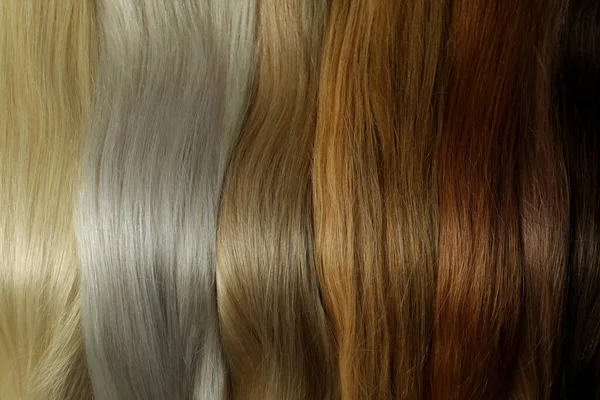 Weibliche Haare Unterschiedlicher Farbe Auf Ganzem Hintergrund Nahaufnahme — Stockfoto
