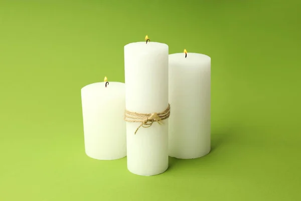 Three Burning Aroma Candles Green Background — Stock Photo, Image