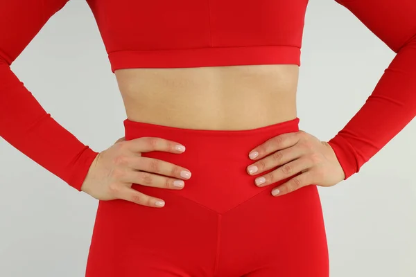 Kvinna Röd Sport Outfit Ljus Bakgrund — Stockfoto