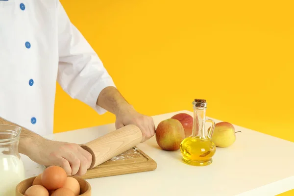 Young Male Chef Cooking Yellow Background — Fotografia de Stock