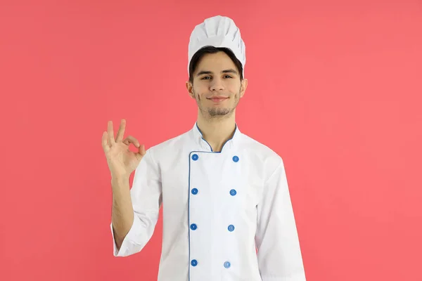 Concept Cooking Young Man Chef Pink Background — Stok Foto