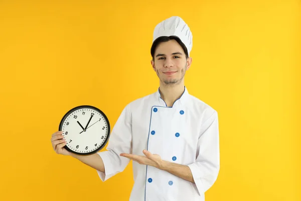 Concept Cooking Young Man Chef Yellow Background — Zdjęcie stockowe