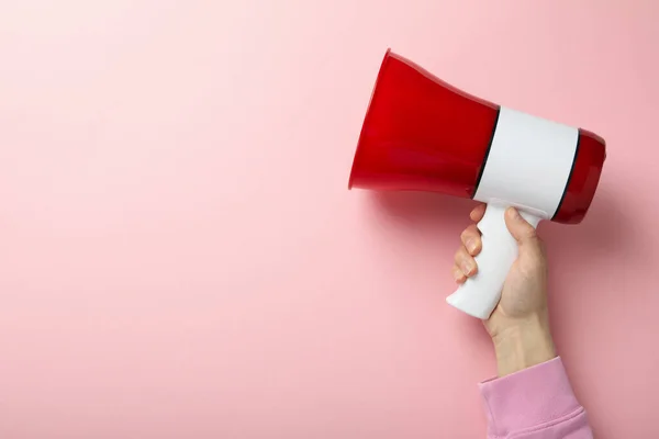 Female Hand Holds Megaphone Pink Background — Stockfoto