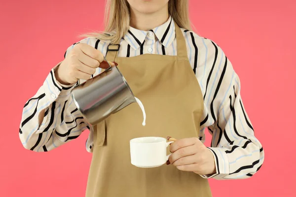 Female Barista Pour Milk Pink Background — Fotografia de Stock