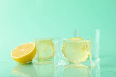 Ice forms with lemon on mint background
