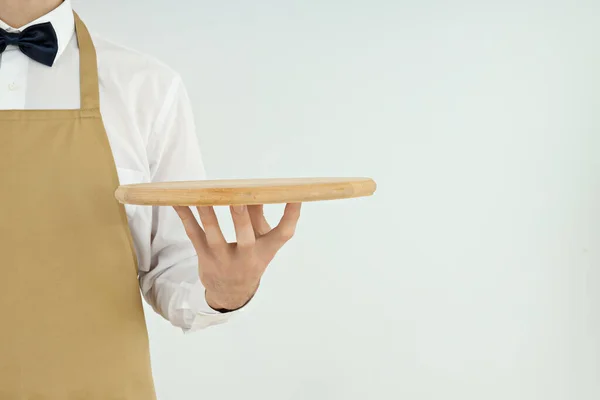 Male Waiter Holds Empty Tray Light Background — Stockfoto