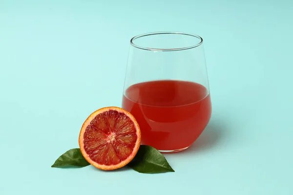 Concept Drink Red Orange Juice Blue Background — Stockfoto