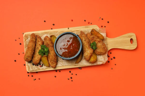 Concept of tasty food with chicken strips, top view