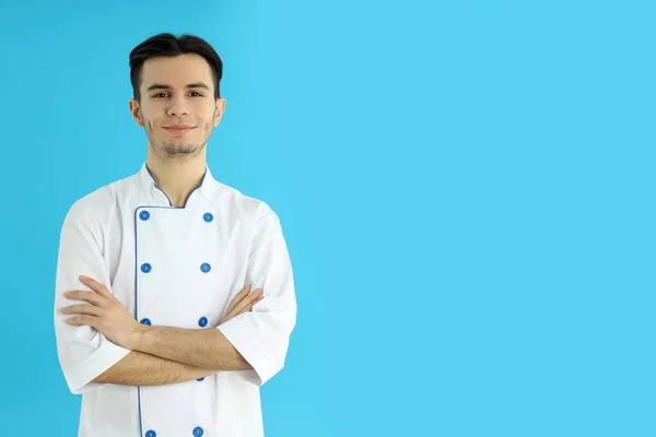 Concept Cooking Young Man Chef Blue Background — Stok fotoğraf