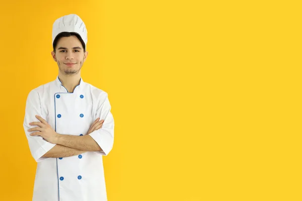 Concept Cooking Young Man Chef Yellow Background — Stok fotoğraf