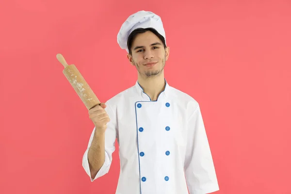 Concept Cooking Young Man Chef Pink Background — Stok fotoğraf