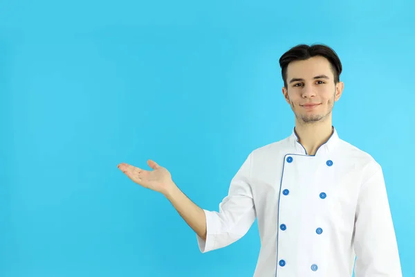 Concept Cooking Young Man Chef Blue Background — Zdjęcie stockowe