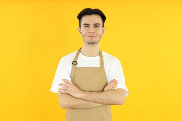 Concept Cooking Young Man Chef Yellow Background — Stok fotoğraf