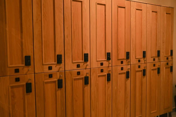 Wooden lockers in locker room in spa center