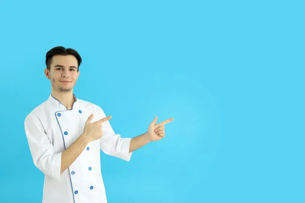 Concept Cooking Young Man Chef Blue Background — Stockfoto