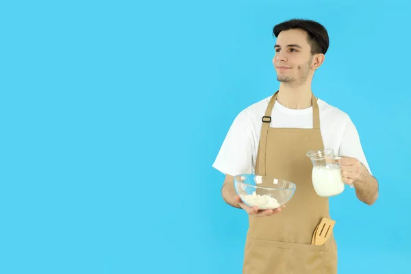 Concept Cooking Young Man Apron Blue Background — Stock Photo, Image