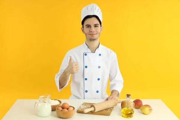 Concept Cooking Young Male Chef Yellow Background — Stock Photo, Image