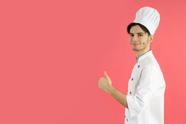 Concept Van Koken Jonge Mannelijke Chef Kok Roze Achtergrond — Stockfoto