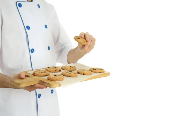 Junger Männlicher Koch Mit Keksen Auf Weißem Hintergrund — Stockfoto